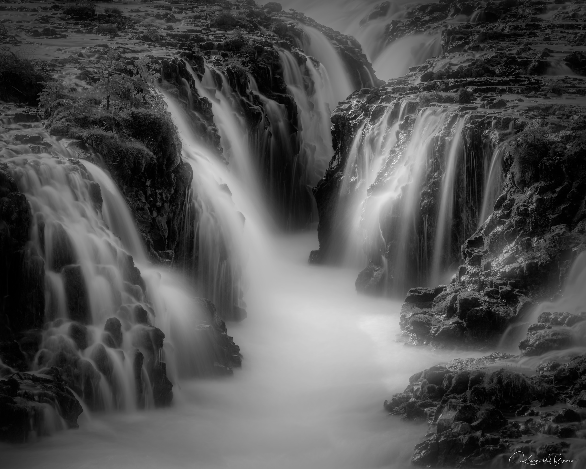 Echoes in Stone In this monochrome portrait of Brúarfoss, color gives way to form, revealing the timeless relationship between water and...