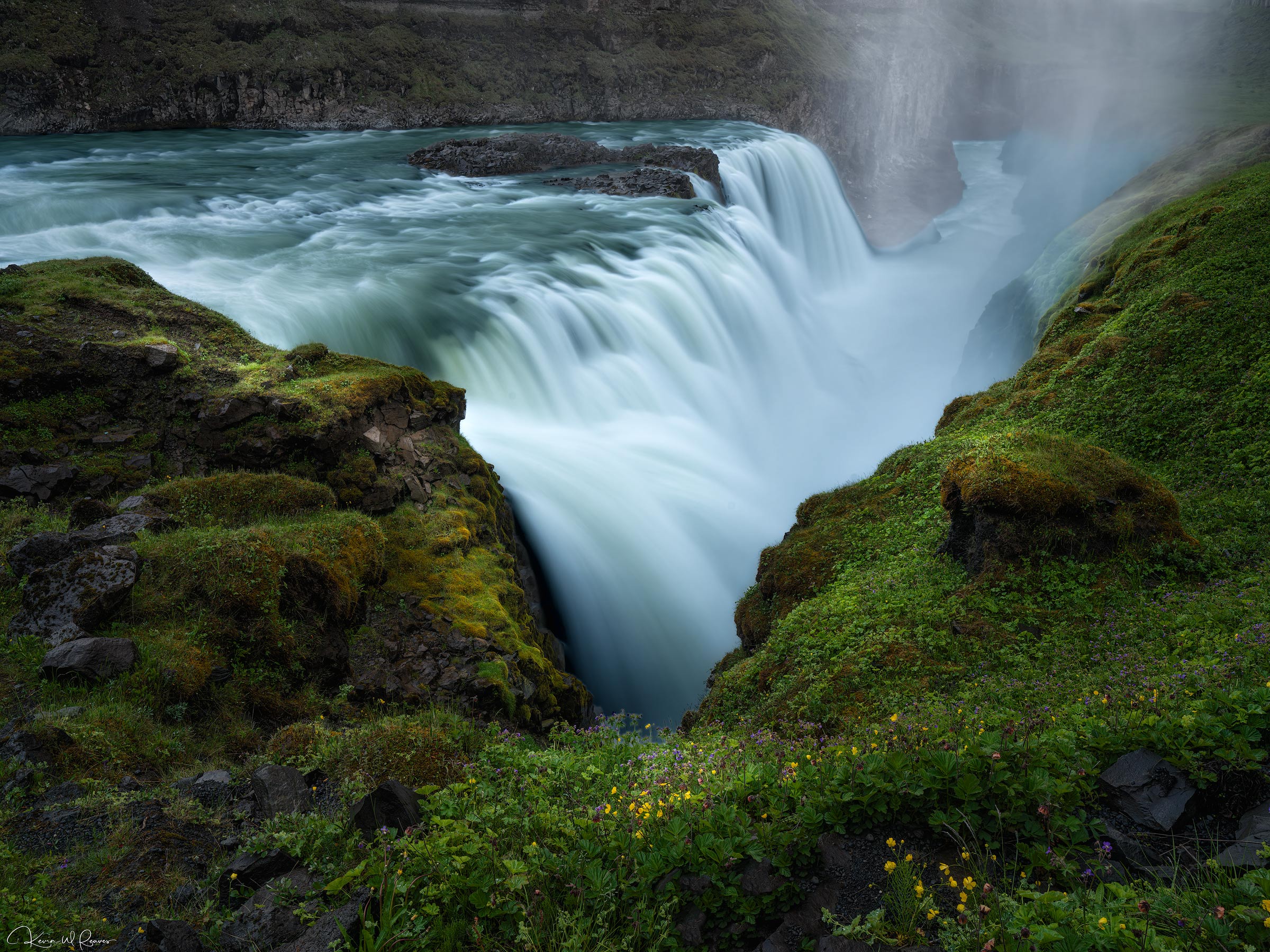 Into the Mist The glacial waters of the Hvítá River gather strength before plunging into the depths of Gullfoss, one of Iceland...