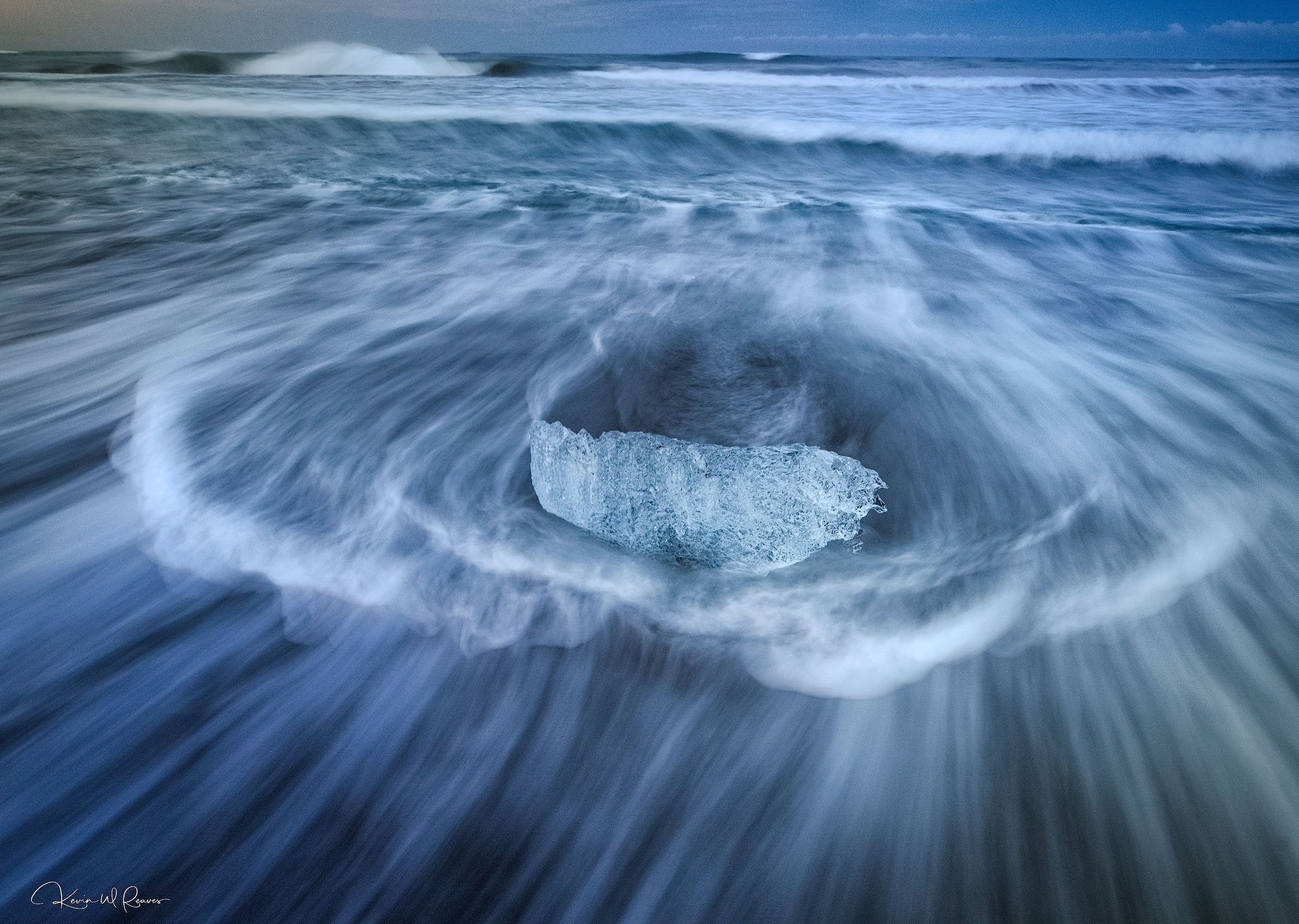 Surrender Born of a glacier and carried to the sea, this shimmering fragment pauses briefly before returning to the ocean. Encircled by...